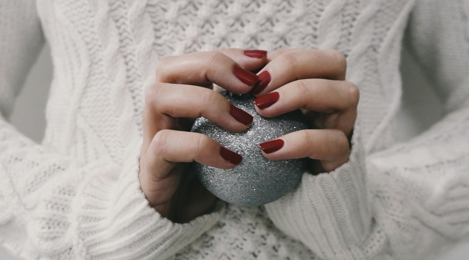 Close-up of elegant deep-red manicured nails