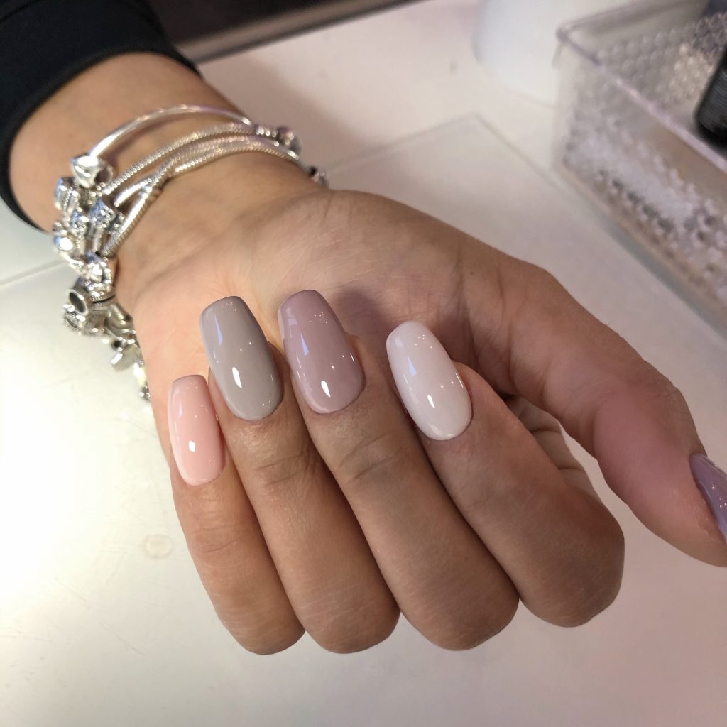 Close-up of a flawless Russian manicure with clean, precise cuticle work