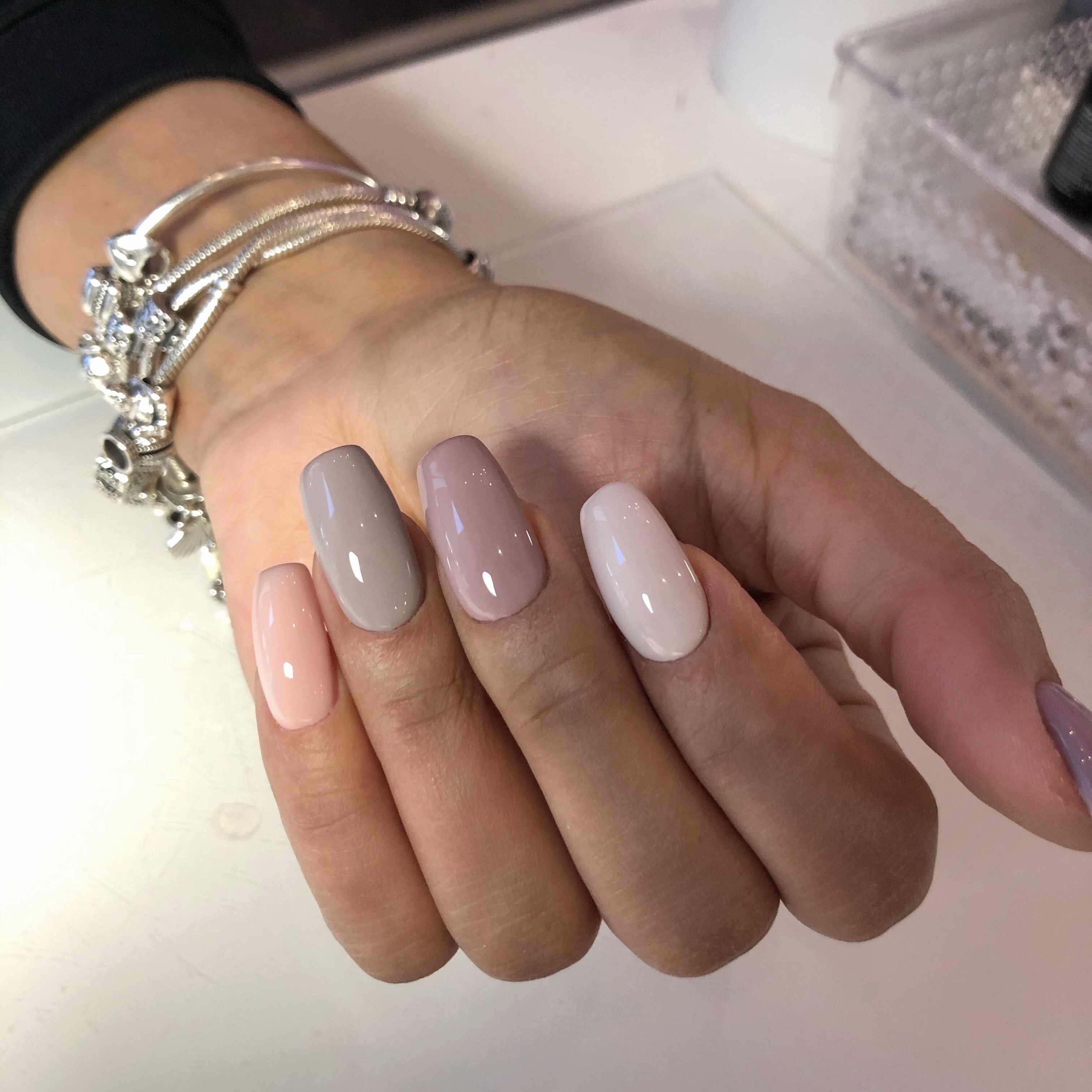 Close-up of a flawless Russian manicure with clean, precise cuticle work